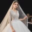 Romantique Ivoire La Mariée Robe De Mariée 2020 Robe Boule Transparentes Col v profond 3/4 Manches Dos Nu Perlage Glitter Tulle Cathedral Train Volants