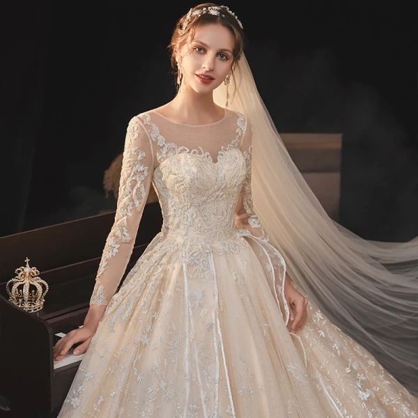 High-end Champagne Bridal Wedding Dresses 2020 Ball Gown See-through Scoop Neck Long Sleeve Backless Appliques Lace Beading Glitter Tulle Cathedral Train Ruffle