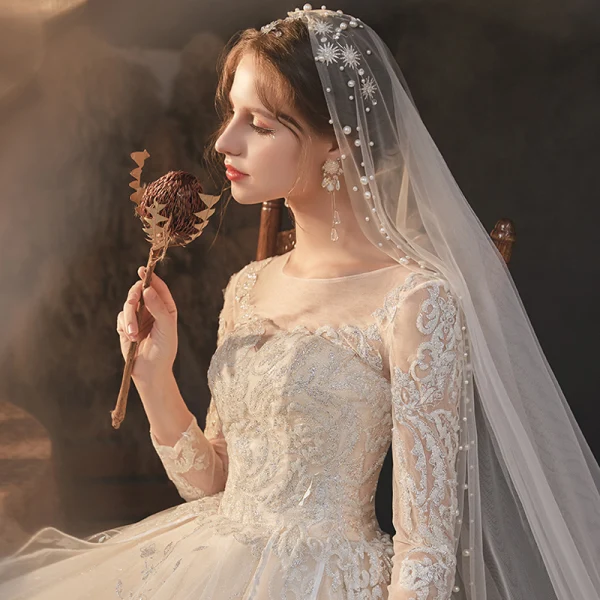 High-end Champagne Bridal Wedding Dresses 2020 Ball Gown See-through Scoop Neck Long Sleeve Backless Appliques Lace Beading Glitter Tulle Cathedral Train Ruffle