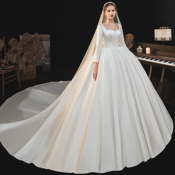 Schlicht Ivory / Creme Satin Hochzeits Brautkleider / Hochzeitskleider 2020 Ballkleid Eckiger Ausschnitt Lange Ärmel Rückenfreies Schleife Perlenstickerei Perle Kathedrale Schleppe Rüschen