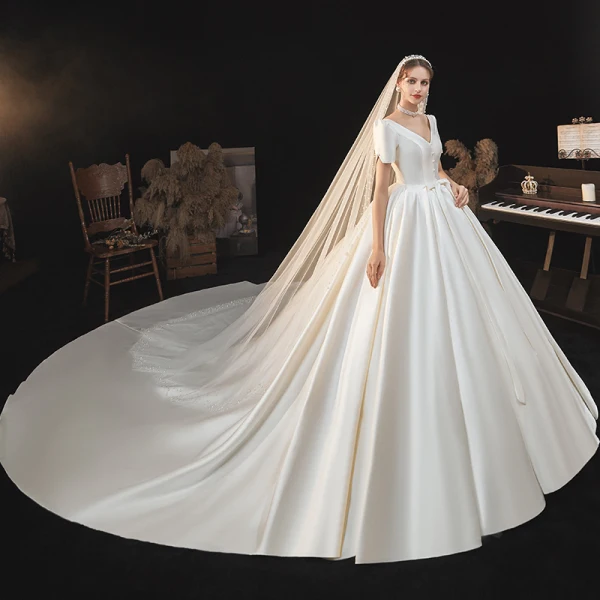 Vintage / Retro Ivory Satin Bridal Wedding Dresses 2020 Ball Gown V-Neck Puffy Short Sleeve Backless Beading Pearl Bow Cathedral Train Ruffle
