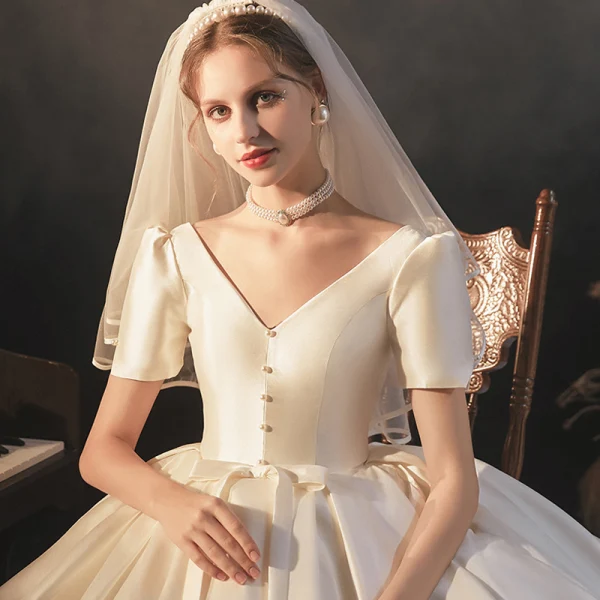Vintage / Retro Ivory Satin Bridal Wedding Dresses 2020 Ball Gown V-Neck Puffy Short Sleeve Backless Beading Pearl Bow Cathedral Train Ruffle