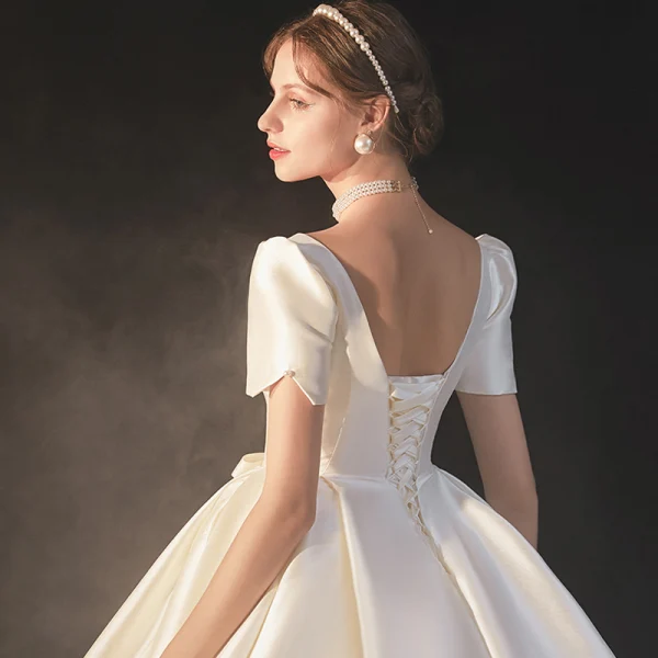 Vintage / Retro Ivory Satin Bridal Wedding Dresses 2020 Ball Gown V-Neck Puffy Short Sleeve Backless Beading Pearl Bow Cathedral Train Ruffle