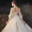Viktorianischer Stil Champagner Durchsichtige Hochzeits Brautkleider / Hochzeitskleider 2020 Ballkleid Stehkragen Geschwollenes 3/4 Ärmel Rückenfreies Applikationen Spitze Perlenstickerei Pailletten Glanz Tülle Kathedrale Schleppe Rüschen