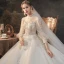 Viktorianischer Stil Champagner Durchsichtige Hochzeits Brautkleider / Hochzeitskleider 2020 Ballkleid Stehkragen Geschwollenes 3/4 Ärmel Rückenfreies Applikationen Spitze Perlenstickerei Pailletten Glanz Tülle Kathedrale Schleppe Rüschen