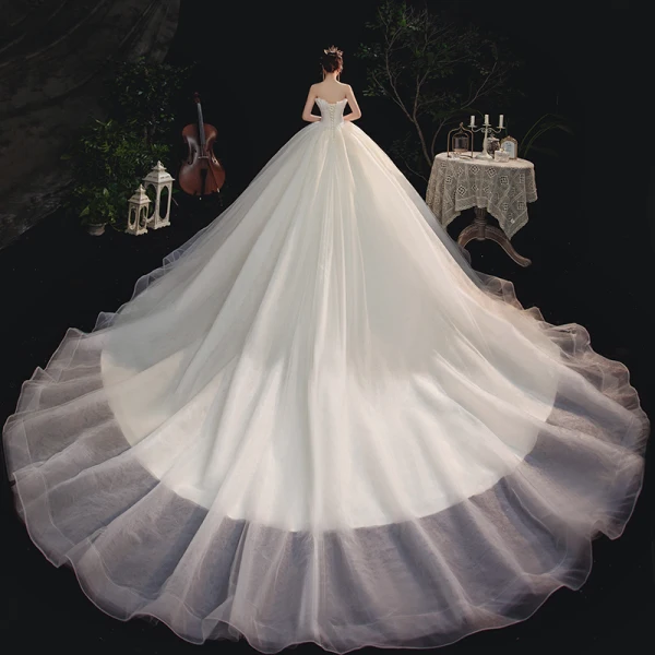 Modest / Simple Ivory Bridal Wedding Dresses 2020 A-Line / Princess Strapless Sleeveless Backless Cathedral Train Ruffle