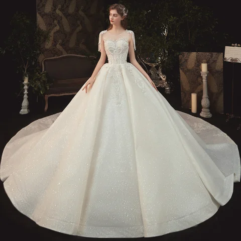 Elegante Champagne Bruids Trouwjurken 2020 Baljurk Doorzichtige Ronde Hals Korte Mouwen Ruglooze Glans Tule Kralen Kwast Appliques Kant Cathedral Train Ruche