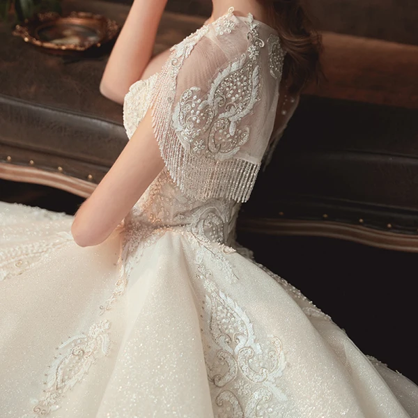 Elegant Champagne Bridal Wedding Dresses 2020 Ball Gown See-through Scoop Neck Short Sleeve Backless Glitter Tulle Beading Tassel Appliques Lace Cathedral Train Ruffle