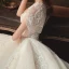 Elegant Champagne Bridal Wedding Dresses 2020 Ball Gown See-through Scoop Neck Short Sleeve Backless Glitter Tulle Beading Tassel Appliques Lace Cathedral Train Ruffle