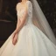 Elegant Champagne Bridal Wedding Dresses 2020 Ball Gown See-through Scoop Neck Short Sleeve Backless Glitter Tulle Beading Tassel Appliques Lace Cathedral Train Ruffle