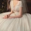 Romantique Champagne La Mariée Robe De Mariée 2020 Robe Boule Transparentes Col v profond Manches Courtes Dos Nu Appliques En Dentelle Perlage Glitter Tulle Cathedral Train Volants