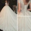 Romantique Champagne La Mariée Robe De Mariée 2020 Robe Boule Transparentes Col v profond Manches Courtes Dos Nu Appliques En Dentelle Perlage Glitter Tulle Cathedral Train Volants