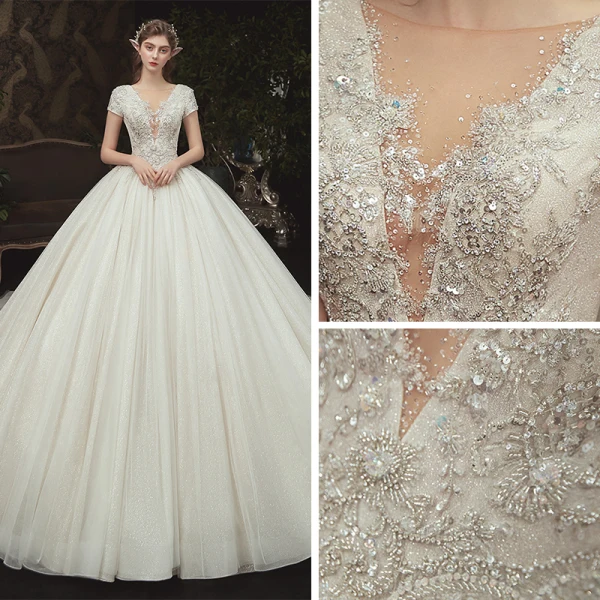 Romantique Champagne La Mariée Robe De Mariée 2020 Robe Boule Transparentes Col v profond Manches Courtes Dos Nu Appliques En Dentelle Perlage Glitter Tulle Cathedral Train Volants