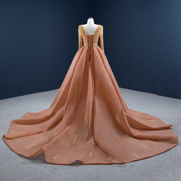 Luxe Orange Tapis rouge Robe De Soirée 2020 Princesse Transparentes Encolure Dégagée Manches Longues Fait main Perlage Paillettes Tribunal Train Volants Dos Nu