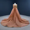 Luksusowe Pomarańczowy Czerwony dywan Sukienki Wieczorowe 2020 Princessa Przezroczyste Wycięciem Długie Rękawy Wykonany Ręcznie Frezowanie Cekiny Trenem Sąd Wzburzyć Bez Pleców