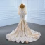 Luxe Champagne La Mariée Robe De Mariée 2020 Trompette / Sirène Transparentes Encolure Carrée Gonflée Manches Longues Dos Nu Appliques En Dentelle Plumes Train De Balayage Volants