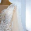 Luxe Champagne La Mariée Robe De Mariée 2020 Trompette / Sirène Transparentes Encolure Carrée Gonflée Manches Longues Dos Nu Appliques En Dentelle Plumes Train De Balayage Volants