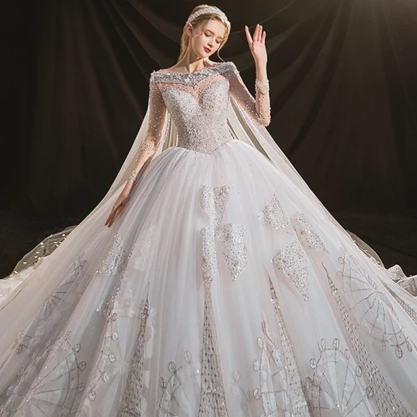 Luxus / Herrlich Ivory / Creme Durchsichtige Hochzeits Brautkleider / Hochzeitskleider 2020 Ballkleid Rundhalsausschnitt Lange Ärmel Rückenfreies Handgefertigt Perlenstickerei Pailletten Abnehmbar Königliche Schleppe Rüschen