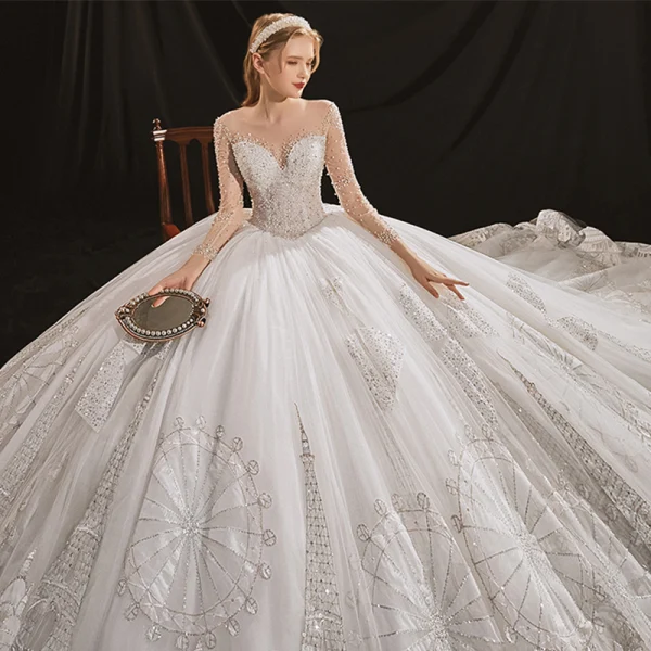 Luxus / Herrlich Ivory / Creme Durchsichtige Hochzeits Brautkleider / Hochzeitskleider 2020 Ballkleid Rundhalsausschnitt Lange Ärmel Rückenfreies Handgefertigt Perlenstickerei Pailletten Abnehmbar Königliche Schleppe Rüschen