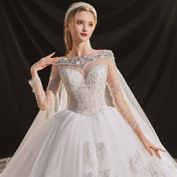 Luxus / Herrlich Ivory / Creme Durchsichtige Hochzeits Brautkleider / Hochzeitskleider 2020 Ballkleid Rundhalsausschnitt Lange Ärmel Rückenfreies Handgefertigt Perlenstickerei Pailletten Abnehmbar Königliche Schleppe Rüschen