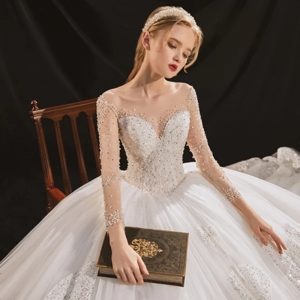 Luxus / Herrlich Ivory / Creme Durchsichtige Hochzeits Brautkleider / Hochzeitskleider 2020 Ballkleid Rundhalsausschnitt Lange Ärmel Rückenfreies Handgefertigt Perlenstickerei Pailletten Abnehmbar Königliche Schleppe Rüschen