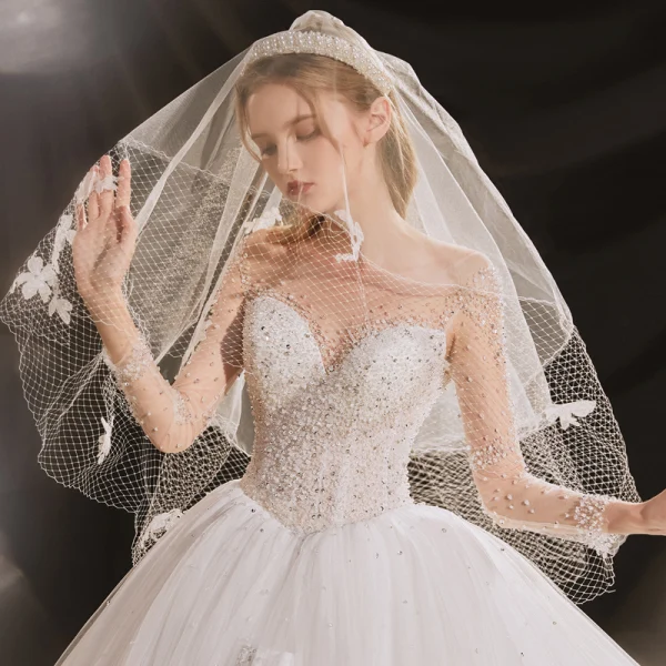 Luxus / Herrlich Ivory / Creme Durchsichtige Hochzeits Brautkleider / Hochzeitskleider 2020 Ballkleid Rundhalsausschnitt Lange Ärmel Rückenfreies Handgefertigt Perlenstickerei Pailletten Abnehmbar Königliche Schleppe Rüschen