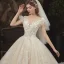 Romantique Champagne La Mariée Robe De Mariée 2020 Robe Boule Transparentes Encolure Carrée Manches Courtes Dos Nu Fleur Appliques En Dentelle Perlage Glitter Tulle Cathedral Train