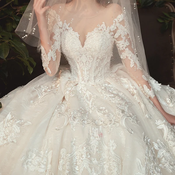 Charming Champagne See-through Bridal Wedding Dresses 2020 Ball Gown Scoop Neck 3/4 Sleeve Appliques Lace Beading Pearl Cathedral Train Ruffle