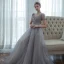 Haut de Gamme Gris Dansant Robe De Bal 2020 Princesse Transparentes Col v profond Manches Courtes Perlage Glitter Tulle Longue Volants Dos Nu Robe De Ceremonie