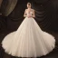 Luxe Ivoire Transparentes La Mariée Robe De Mariée 2020 Robe Boule Col Haut Manches Courtes Dos Nu Glitter Tulle Perlage Perle Cathedral Train Volants