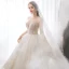 Romantic Champagne See-through Bridal Wedding Dresses 2020 Ball Gown Scoop Neck Long Sleeve Backless Appliques Lace Beading Glitter Tulle Cathedral Train Ruffle