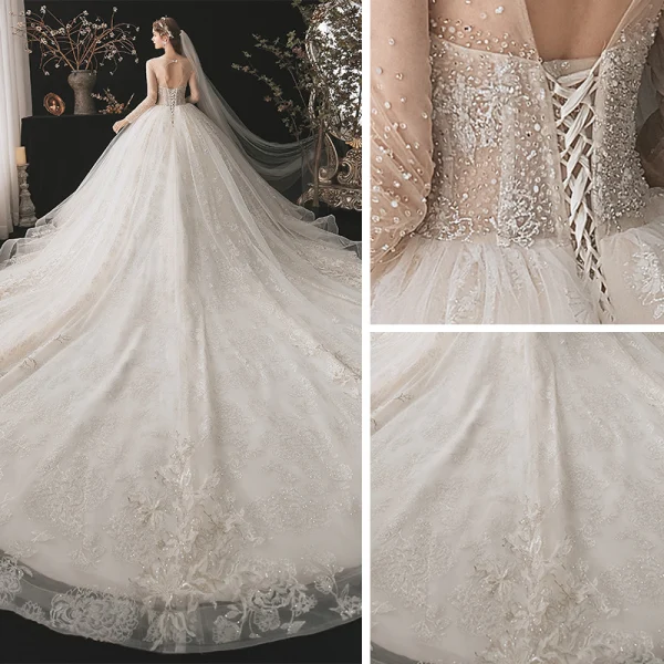 Romantic Champagne See-through Bridal Wedding Dresses 2020 Ball Gown Scoop Neck Long Sleeve Backless Appliques Lace Beading Glitter Tulle Cathedral Train Ruffle