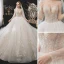 Romantic Champagne See-through Bridal Wedding Dresses 2020 Ball Gown Scoop Neck Long Sleeve Backless Appliques Lace Beading Glitter Tulle Cathedral Train Ruffle