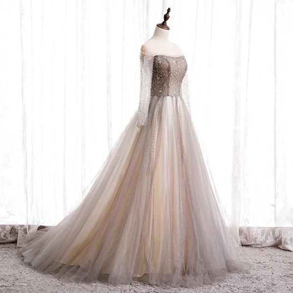 Charmant Champagne Dansant Robe De Bal 2020 Princesse Transparentes Encolure Dégagée Manches Longues Perlage Glitter Tulle Train De Balayage Volants Dos Nu Robe De Ceremonie