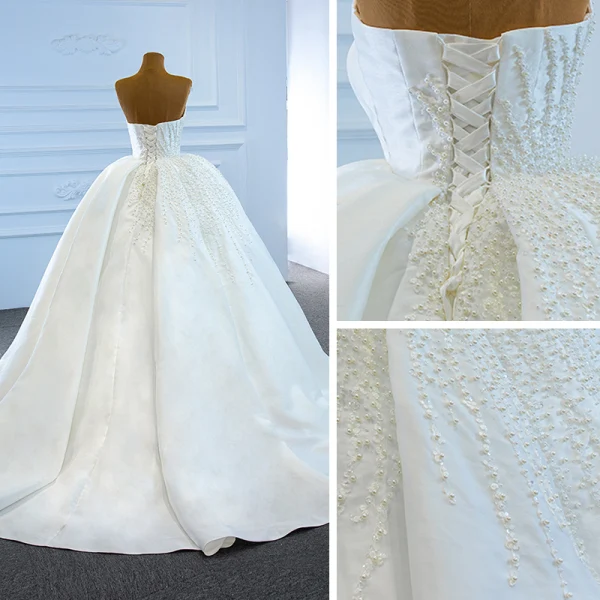 Luxe Blanche Satin La Mariée Robe De Mariée 2020 Robe Boule Bustier Sans Manches Dos Nu Fait main Perlage Perle Chapel Train Volants