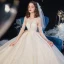 High-end Champagne See-through Bridal Wedding Dresses 2020 Ball Gown Scoop Neck 3/4 Sleeve Backless Leaf Appliques Lace Beading Glitter Tulle Cathedral Train Ruffle