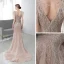 Luxe Champagne Tapis rouge Robe De Soirée 2020 Trompette / Sirène Col v profond Sans Manches Plumes Perlage Train De Balayage Volants Dos Nu Robe De Ceremonie