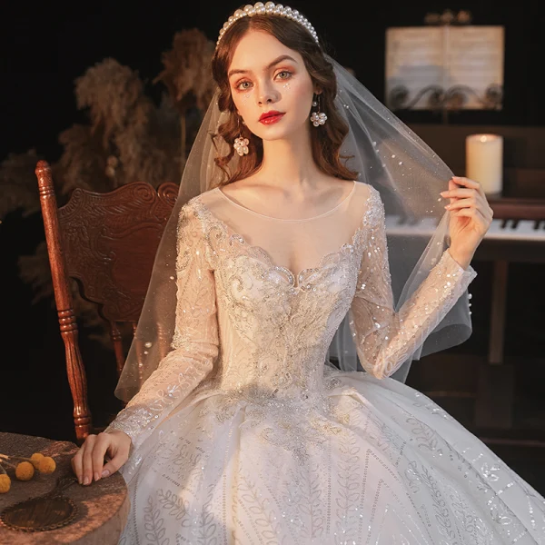 Sparkly Ivory See-through Bridal Wedding Dresses 2021 Ball Gown Scoop Neck Long Sleeve Backless Beading Sequins Cathedral Train Ruffle