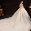Vintage / Retro Ivory See-through Bridal Wedding Dresses 2021 Ball Gown High Neck Long Sleeve Backless Appliques Lace Beading Pearl Cathedral Train Ruffle