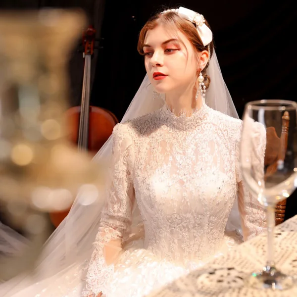 Vintage / Retro Ivory See-through Bridal Wedding Dresses 2021 Ball Gown High Neck Long Sleeve Backless Appliques Lace Beading Pearl Cathedral Train Ruffle