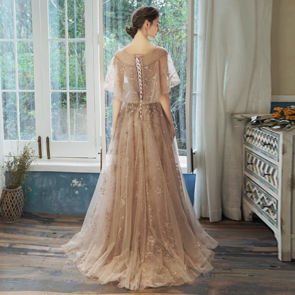 Bling Bling Champagne Transparentes Robe De Bal 2021 Princesse Encolure Carrée Sans Manches Perlage Glitter Appliques Train De Balayage Volants Dos Nu Robe De Ceremonie