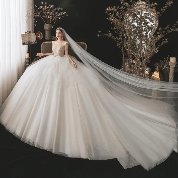 Illusion Champagne La Mariée Robe De Mariée 2021 Robe Boule Transparentes Encolure Dégagée Manches Courtes Dos Nu Paillettes Perlage Glitter Tulle Cathedral Train Volants