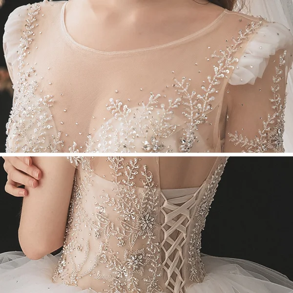 Illusion Champagne La Mariée Robe De Mariée 2021 Robe Boule Transparentes Encolure Dégagée Manches Courtes Dos Nu Paillettes Perlage Glitter Tulle Cathedral Train Volants