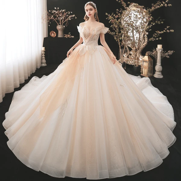 Charmant Champagne Transparentes La Mariée Robe De Mariée 2021 Robe Boule De l'épaule Manches Courtes Dos Nu Appliques En Dentelle Paillettes Perlage Glitter Tulle Cathedral Train Volants