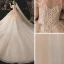 Charmant Champagne Transparentes La Mariée Robe De Mariée 2021 Robe Boule De l'épaule Manches Courtes Dos Nu Appliques En Dentelle Paillettes Perlage Glitter Tulle Cathedral Train Volants