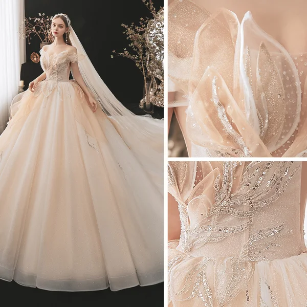 Charmant Champagne Transparentes La Mariée Robe De Mariée 2021 Robe Boule De l'épaule Manches Courtes Dos Nu Appliques En Dentelle Paillettes Perlage Glitter Tulle Cathedral Train Volants