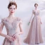 Élégant Rougissant Rose Robe De Bal 2021 Princesse De l'épaule Manches Courtes Appliques Paillettes Perlage Glitter Tulle Train De Balayage Volants Dos Nu Robe De Ceremonie