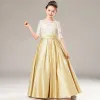 Chic / Beautiful Gold Satin Birthday Flower Girl Dresses 2021 A-Line / Princess See-through Scoop Neck 1/2 Sleeves Appliques Lace Sash Floor-Length / Long Ruffle