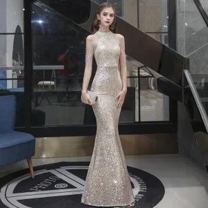 Brillante Champán Lentejuelas Vestidos De Noche 2021 Trumpet Mermaid Cuello Alto Sin Mangas Rebordear Largos Ruffle Vestidos Formales