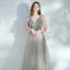 Élégant Argenté Dansant Robe De Bal 2021 Princesse Col v profond Sans Manches Paillettes Tachetée Tulle Longue Volants Dos Nu Robe De Ceremonie